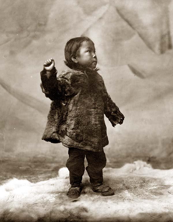 Eskimo child posing while