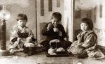Three children eating, Japan