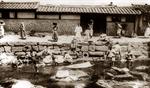 Women washing laundry in