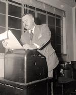 Man at Teletype Machine