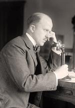 Man Talking on Telephone