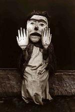 Kwakiutl person wearing an oversize mask and hands representing a forest spirit, Nuhlimkilaka, (
